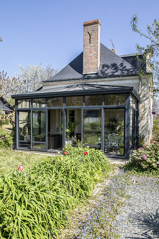 Veranda donnant sur un jardin